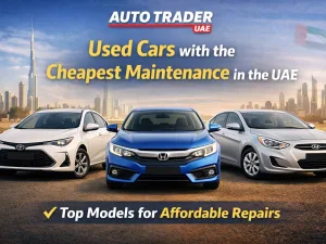 Used compact cars parked in a UAE setting, representing models with the cheapest maintenance