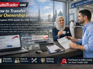Customer completing car ownership transfer paperwork at an RTA service center in Dubai