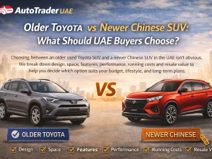 Older Toyota SUV vs newer Chinese SUV parked side by side in a UAE urban setting