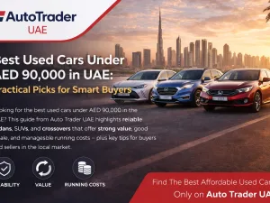 Used cars under AED 90,000 lined up in a UAE dealership parking area