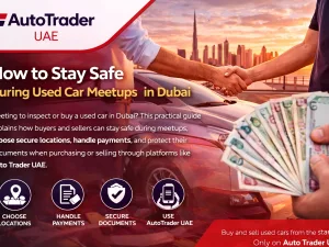 Buyer and seller meeting safely in a public car park in Dubai to inspect a used car