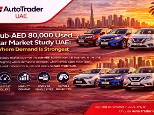 Used cars parked in a UAE dealership lot with price tags under AED 80,000