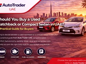 Used hatchback and compact sedan parked side by side in a UAE city parking area