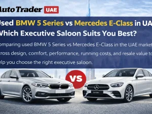 Used BMW 5 Series and Mercedes E-Class parked side by side in the UAE