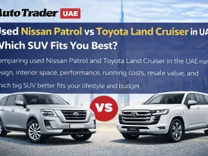 Used Nissan Patrol and used Toyota Land Cruiser parked side by side in UAE desert
