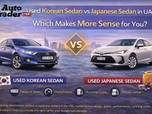 Used Korean and Japanese sedans parked side by side in UAE