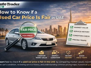 Used cars parked in a UAE dealership lot with price tags on windshields