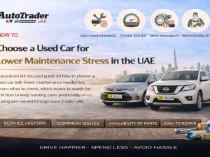 Used car buyer reviewing maintenance records at a workshop in the UAE
