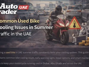 Used motorcycle stuck in UAE summer traffic showing engine cooling system components