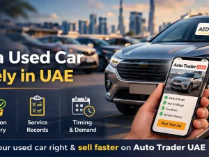 Seller checking online prices to accurately price a used car in the UAE