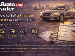 Seller and buyer completing paperwork to sell a financed used car in the UAE