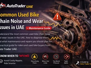 Used motorcycle chain being inspected for wear and noise issues in UAE workshop