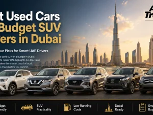 Line-up of budget-friendly used SUVs parked in Dubai with city skyline in the background
