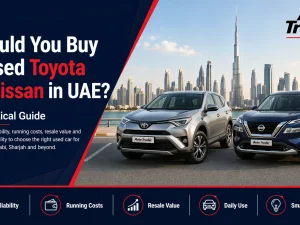 Used Toyota and Nissan cars parked in a UAE dealership lot