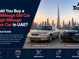 Used cars parked in a UAE dealership showing a mix of older low mileage and newer high mileage models