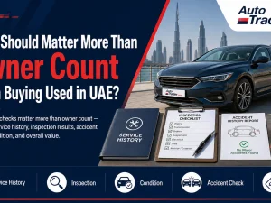 Buyer checking used car condition in UAE showroom focusing beyond owner count