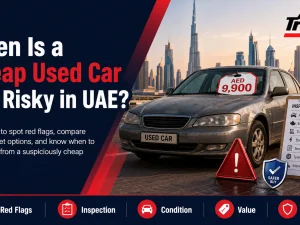 Buyer inspecting a cheap used car in the UAE to check if it is too risky