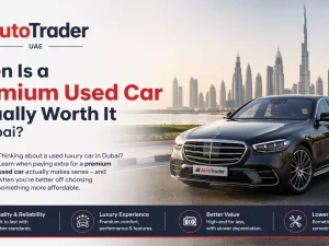Premium used luxury car parked in Dubai marina at sunset