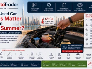 Mechanic checking engine oil and coolant in a used car during UAE summer
