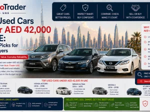 Line-up of affordable used cars parked in a UAE city under evening light