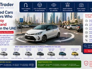 Compact used car making a tight U-turn on a city street in the UAE