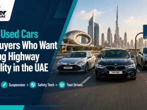 Used sedan driving steadily on a UAE highway lane