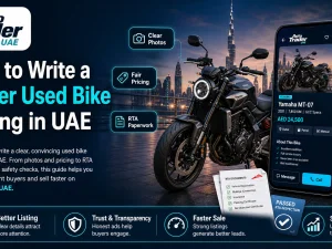Seller photographing a used motorcycle for an online listing in UAE