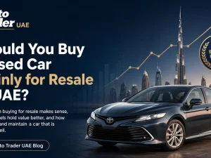 Used cars parked in the UAE with a buyer comparing prices for future resale