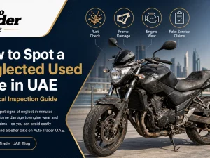 Used motorcycle being inspected in UAE parking for signs of neglect