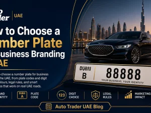 Business car in the UAE with branded livery and a clear number plate parked in front of commercial buildings