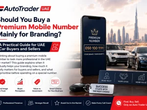 Premium mobile number on a business card next to car keys in the UAE