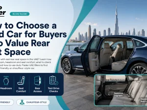 Family checking rear seat space in a used car in the UAE