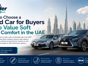 Used luxury sedan driving comfortably on a UAE highway