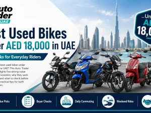 Used budget motorcycle parked in UAE with city skyline in background