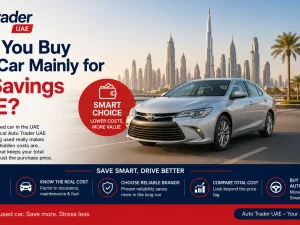 Used cars parked in a UAE dealership lot at sunset