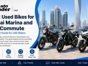 Used commuter motorcycle parked near Dubai Marina high-rise towers at sunset