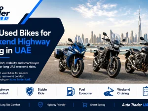 Used touring motorcycle cruising on a UAE highway at sunset