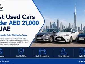 Line-up of affordable used cars parked in a UAE urban setting