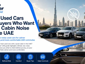 Used luxury sedan driving on a UAE highway with a quiet, refined cabin