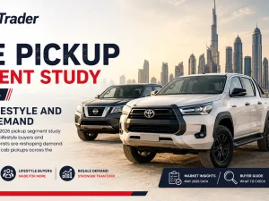 Used pickup trucks lined up at a UAE dealership, showing single and double cab models