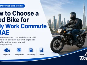 Used commuter motorcycle parked in a UAE city street near office buildings