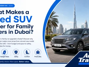 Used family SUV driving on a Dubai road at sunset