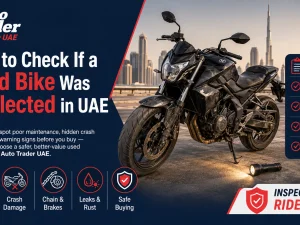 Buyer inspecting a used motorcycle for signs of neglect in the UAE