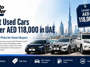 Used cars under AED 118,000 parked in a UAE dealership lot at sunset