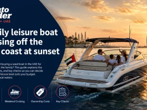 Family leisure boat cruising off the UAE coast at sunset