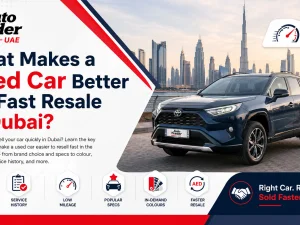 Used cars parked in Dubai with city skyline in the background