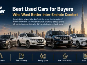 Used mid-size sedan cruising comfortably on a UAE highway between emirates