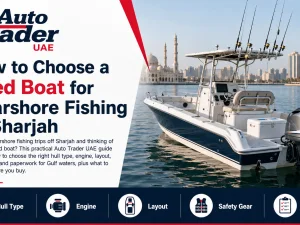 Used center console fishing boat cruising near the coast in Sharjah