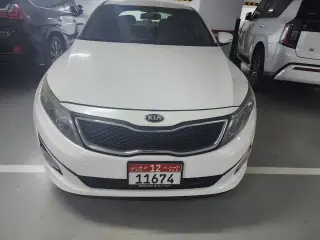 2015 Kia Optima في Abu Dhabi سيارة مستعملة