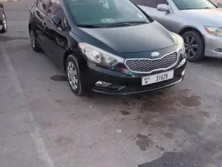 2013 Kia K3 في Ajman سيارة مستعملة